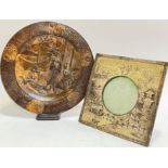 A Japanese Meiji style bronzed dish with scenes of ladies and dogs, the border decorated with