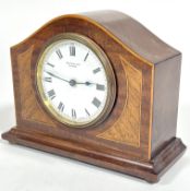 A Edwardian mahogany inlaid and boxwood strung arched mantle clock retailed by Rattray & Co Dundee