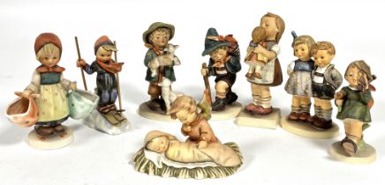 A collection of eight Hummel German pottery figures including, Mothers Darling, Gay Adventure,