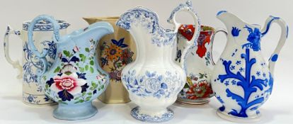 A mixed group of jugs comprising an early Victorian Copeland and Garrett sleigh topped jug with blue