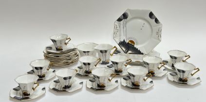 A Melba Bone China Art Deco style, with the rising sun and stylized pom pom trees decorated part tea