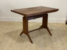 Wilhelm Renz, a Danish style mid century teak metamorphic dining table, with a lifting and fold over