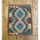 A Chobi kilim mat of typical design 55cm x 45cm