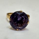 A yellow metal solitaire Tanzanite dress ring mounted in high claw setting, (D x 1.2cm) N/O. 4.42g