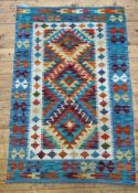 A Chobi Kilim rug of typical design 145cm x 96cm