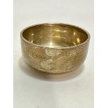 A Birmingham silver bowl with folded rim on plain foot, (H x 4.5cm x D x 9cm), slight bump to