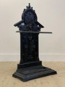 A Victorian cast iron stick stand, the back depicting an urn issuing a bouquet of flowers enclosed