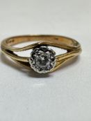 A 18ct gold solitaire diamond ring, mounted in claw set illusion setting of open form, M/N, 3.03g