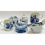 A group of early Worcester blue and white porcelain comprising a mug with flower decoration (