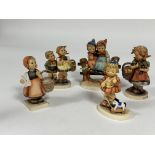 A collection of six German Hummel pottery figures including, My Favourite Pony, Autumn Harvest and