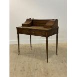 A Georgian Carlton House style mahogany writing desk, second half of the 20th century, the galleried