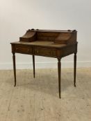 A Georgian Carlton House style mahogany writing desk, second half of the 20th century, the galleried