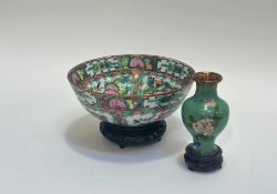A Japanese/Chinese famille verte porcelain bowl decorated in polychrome enamels with butterflies/