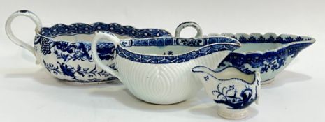 A group of early English blue and white porcelain sauce boats comprising an eighteenth century Derby
