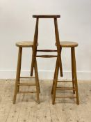 A pair of Vintage beech bar stools (H72cm) together with another similar (H68cm)
