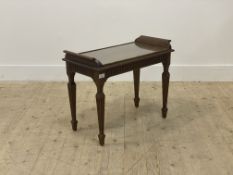 An early 20th century mahogany end table, the top with plate glass above fluted frieze and square