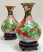 A pair of large Chinese cloisonne vases with carved hardwood stands, the body decorated with