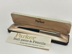 A Vintage Parker stainless steel capped fountain pen with mid blue plastic case, original box,