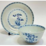 An 18thc Chinese Nanking Cargo blue and white porcelain cup and saucer with pine tree decoration (