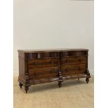 A Victorian mahogany commode or chest of drawers of serpentine outline, fitted with two frieze