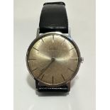 A gent's Vintage Zodiac stainless steel slim manual wind wrist watch with silvered dial and baton