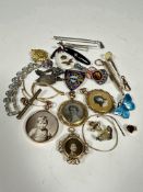 A collection of vintage jewellery including a 9ct gold doubled sided portrait locket with knot