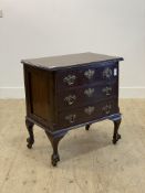 A Georgian style walnut three drawer chest, early 20th century, ball and claw carved cabriole