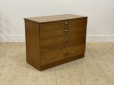 A mid century teak chest fitted with four drawers H67cm, W85cm, D43cm