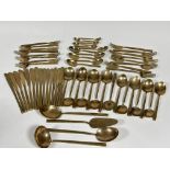 A large suite of 1960/70's bronze flatware, comprising fifteen desert spoons, various sizes, six