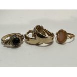 A 18ct gold ring set oval shell carved cameo, section to side damaged, a gilt metal paste set