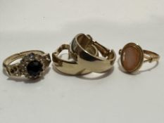A 18ct gold ring set oval shell carved cameo, section to side damaged, a gilt metal paste set