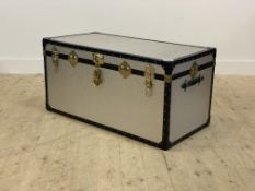 A vintage aluminium travelling trunk, with plain interior and carry handle to each end H50cm, W100cm