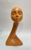 A 1950's/60's moulded fibre figure of a female mannequin head. (h-50cm, w-24cm)