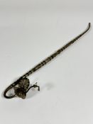 A 20thc white metal Chinese Opium pipe of tapered tubular form with stylised Peacock bowl with
