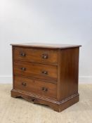 An Edwardian mahogany chest fitted with three long drawers, raised on a skirted base, H83cm,