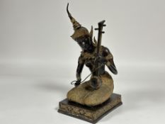 A modern Thai bronze cast seated female musician figure with Lao guitar, dressed in tradition sarong