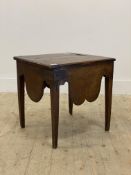 A George III mahogany, elm and oak commode, the hinged top opening to a recess above shaped apron