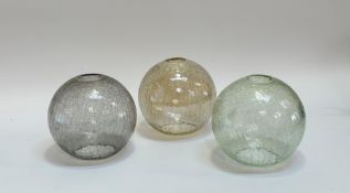 A trio of crackled glass oval shades one light green, light black and light yellow. (w-18cm h-
