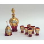 A Bohemian decorative red glass set of six shot glasses (h-7cm), a decanter with stopper (h-25cm)