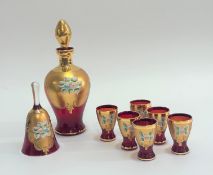 A Bohemian decorative red glass set of six shot glasses (h-7cm), a decanter with stopper (h-25cm)