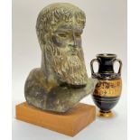 A bronze effect earthenware bust modelled on an ancient Greek original and mounted on wooden base (