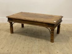 A Rustic stained hardwood and metal bound coffee table, the rectangular top raised on turned