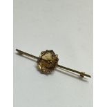 A 9ct gold bar brooch set octagonal faced Citrine mounted in double four claw setting, (L x 6.5cm