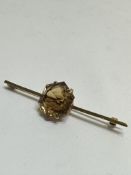 A 9ct gold bar brooch set octagonal faced Citrine mounted in double four claw setting, (L x 6.5cm