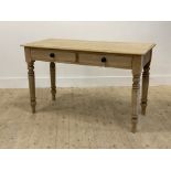 A Victorian pine side table, fitted with two drawers raised on turned supports H75cm< W122cm< D55cm