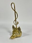 A Edwardian style cast brass Fox head door stop with scrolling ivy leaf handle. ( H x 40cm x W 11.