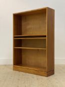 A mid century teak open bookcase, fitted with three adjustable shelves, H107cm, W76cm, D23cm