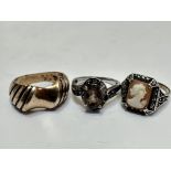 A silver scroll dress ring set oval Cairngorm mounted in four claw setting, with clear set scroll