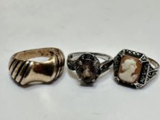A silver scroll dress ring set oval Cairngorm mounted in four claw setting, with clear set scroll