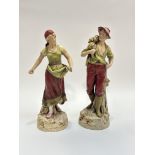 A pair of Royal Dux Bohemia porcelain figures, one of a man holding a hand plow and haystack on